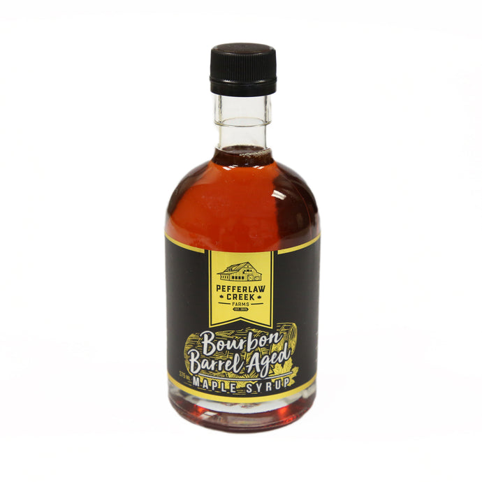 Maple syrup in clear glass bottle