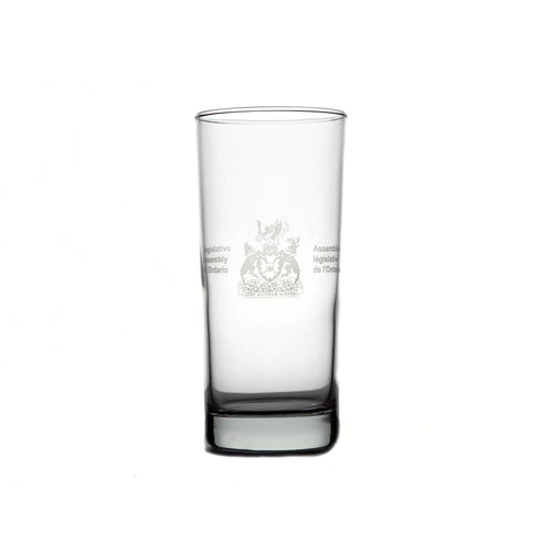 Clear tall glass with Legislative Assembly coat of arms etched in the centre