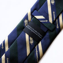 Load image into Gallery viewer, Back of silk tie with blue, green and gold diagonal stripes, the legislative Mace in gold, and Legislative Assembly of Ontario wording in English and French