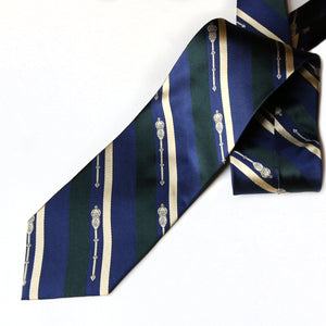 Silk tie with blue, green and gold diagonal stripes and the legislative Mace in gold