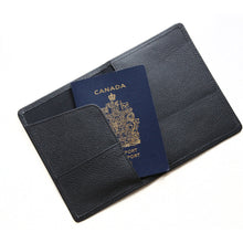Load image into Gallery viewer, Black leather passport holder holding a Canadian passport