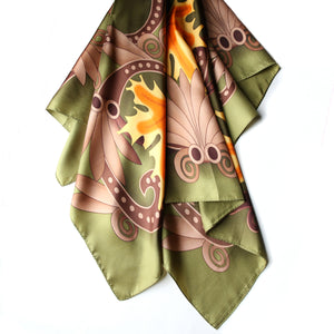 Silk scarf featuring maple leaf artwork in green, orange, yellow and brown from the Legislative Chamber ceiling