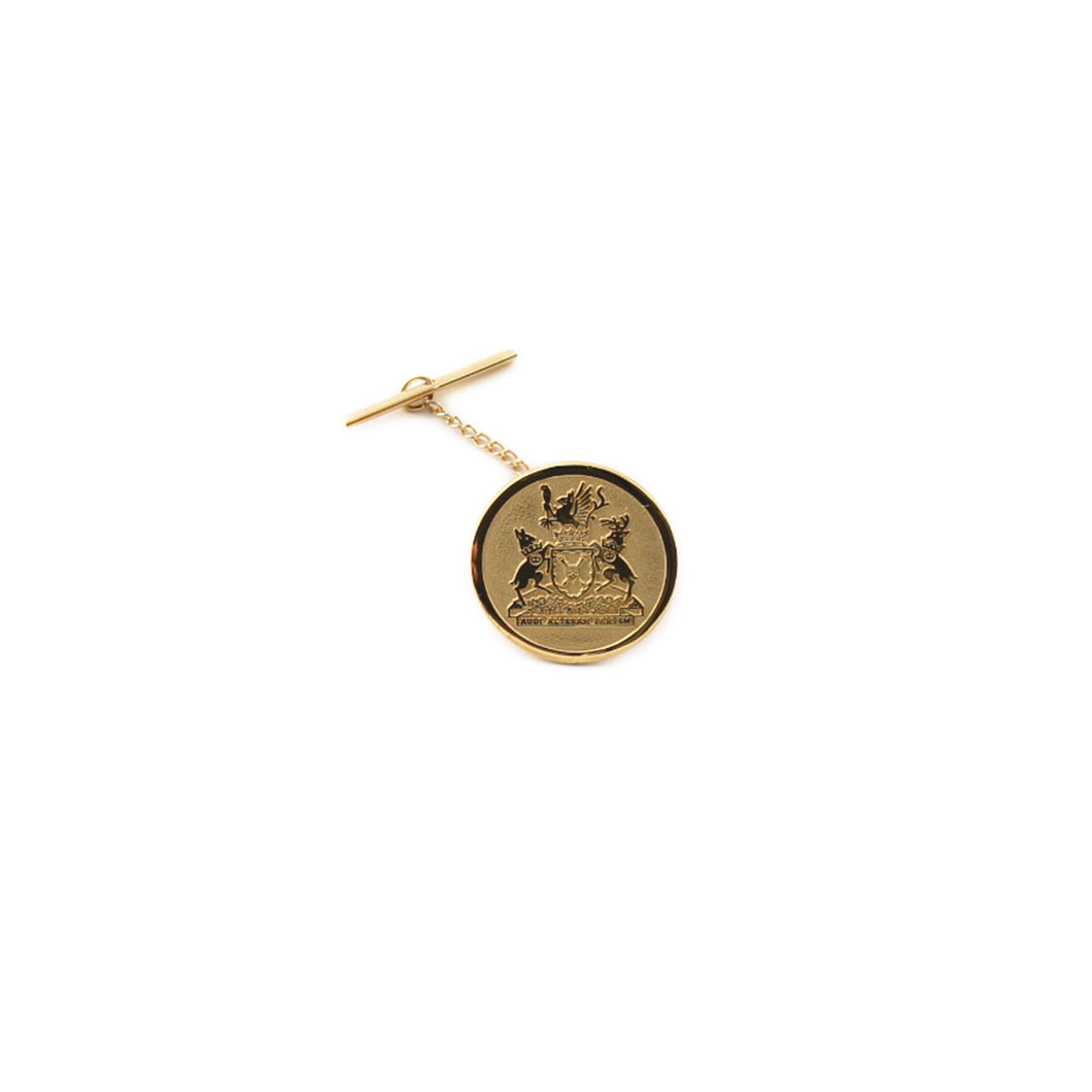 Round shaped sterling silver tie pin plated in 24 kt gold with Legislative Assembly coat of arms