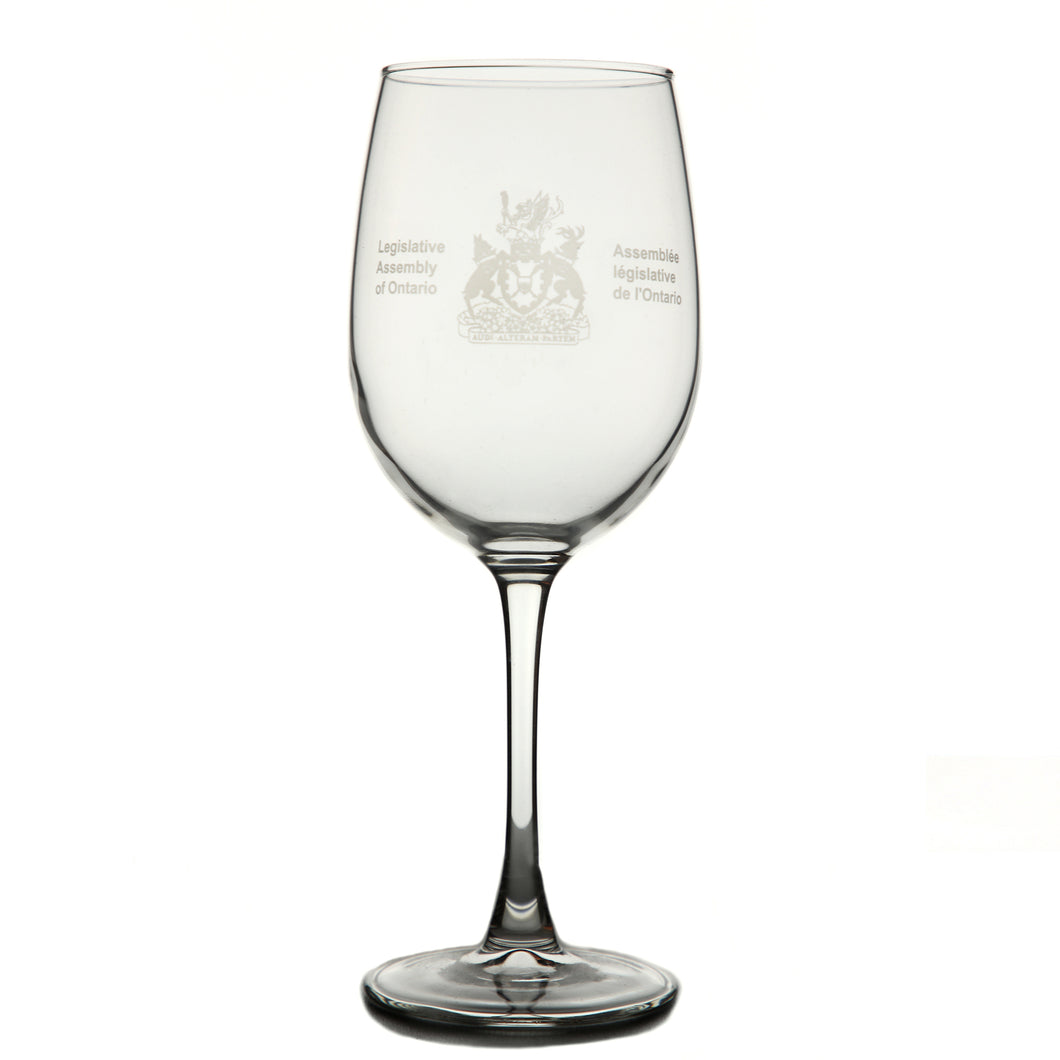 Clear wine glass etched with the Legislative Assembly coat of arms on the centre of glass.