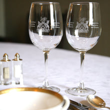 Load image into Gallery viewer, two clear wine glasses etched with the Legislative Assembly of Ontario coat of arms in their centres